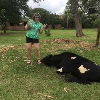 student with cow in Bolivia